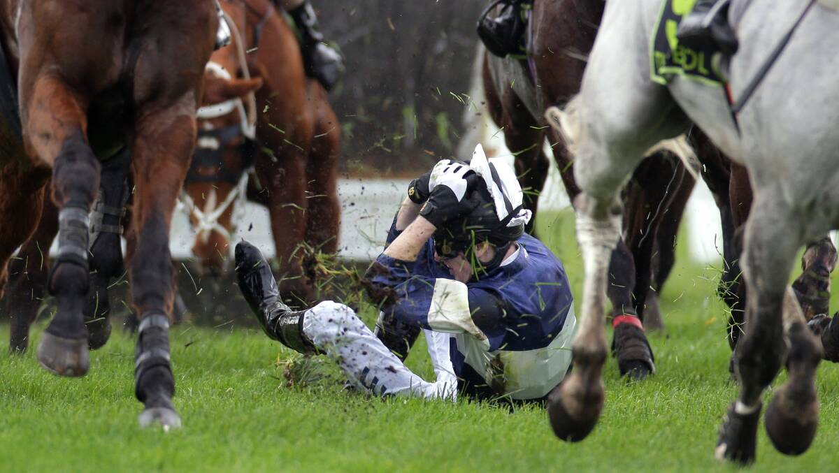 Jockey Lee Horner braced for the worst after falling from Bold Image during a steeplechase at the Warrnambool racecourse in August. Picture: DAMIAN WHITE