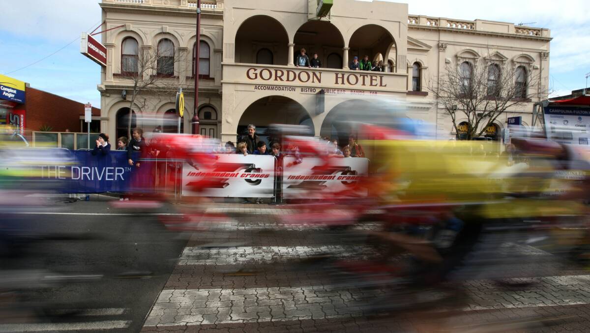 Riders go past Gordon Hotel on Bentick Street in Portland during the Tour of The Great South Coast in August. Picture: LEANNE PICKETT. 