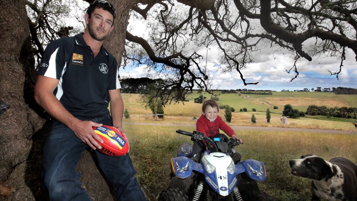 Allansford recruit Justin Nowell, a full forward who used to play for Dennington, has joined Allansford after a two-year break from football. Pictured here on the family farm with his son Logan, 3. Picture: DAVE LANGLEY
