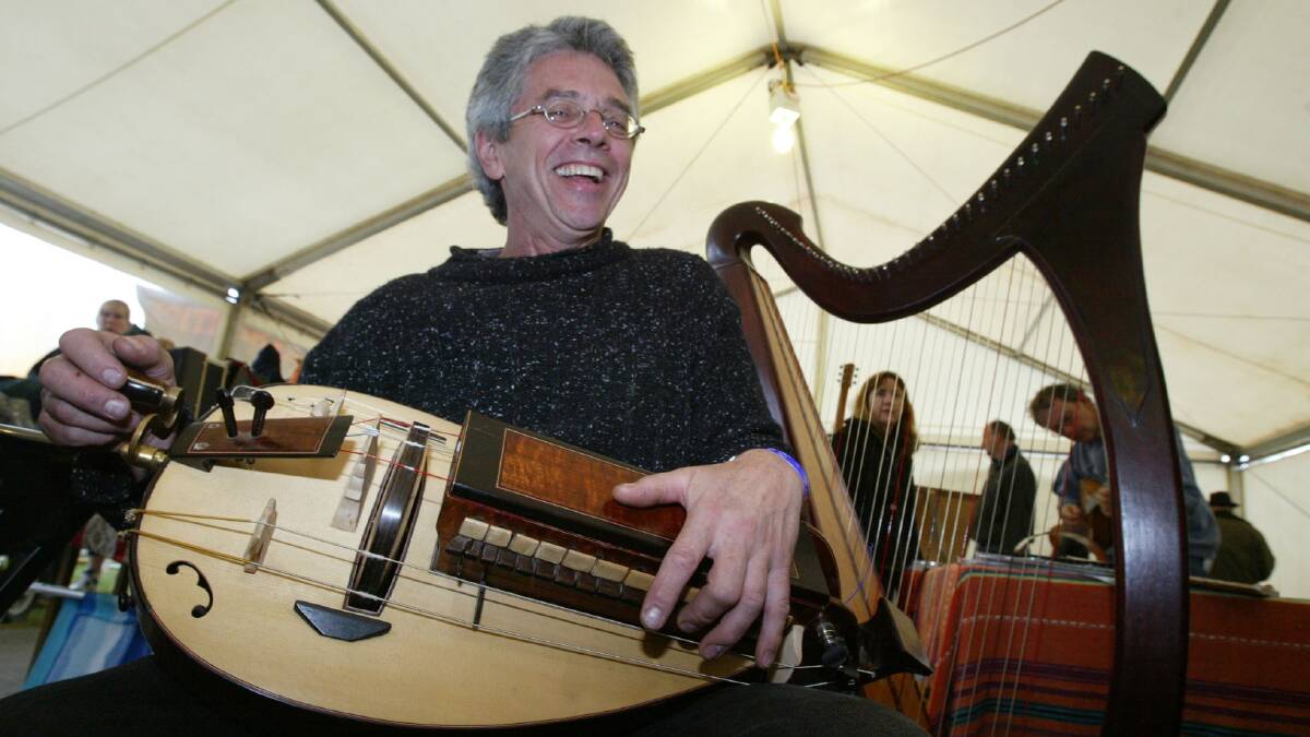 Harp and Huroy Gurdy maker Tim Guster from Adelaide in the instrument makers tent.