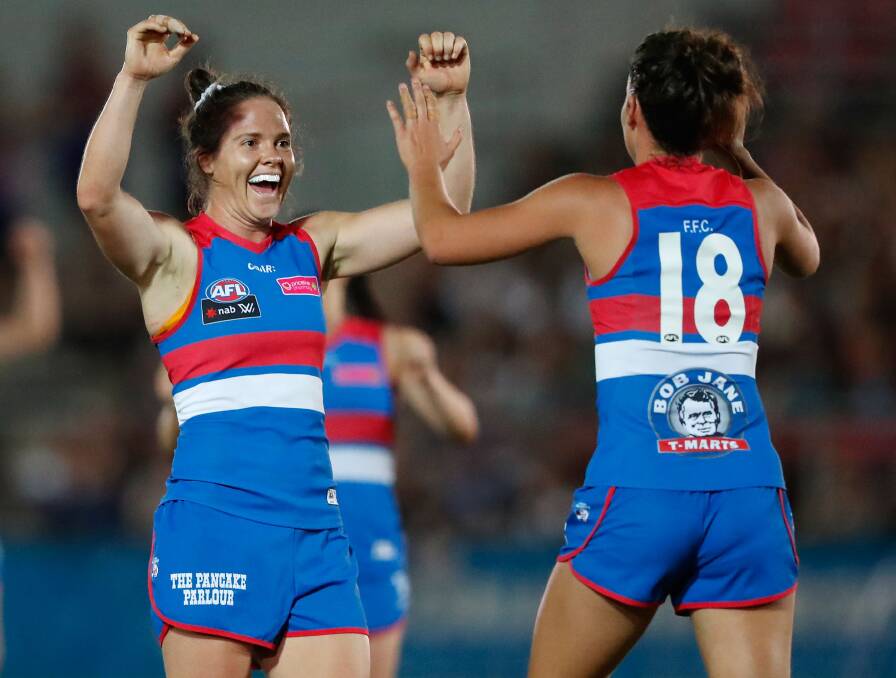 ELATED: Cavendish product Emma Kearney celebrates with teammate Libby Birch during a Western Bulldogs match. Picture: Getty Images