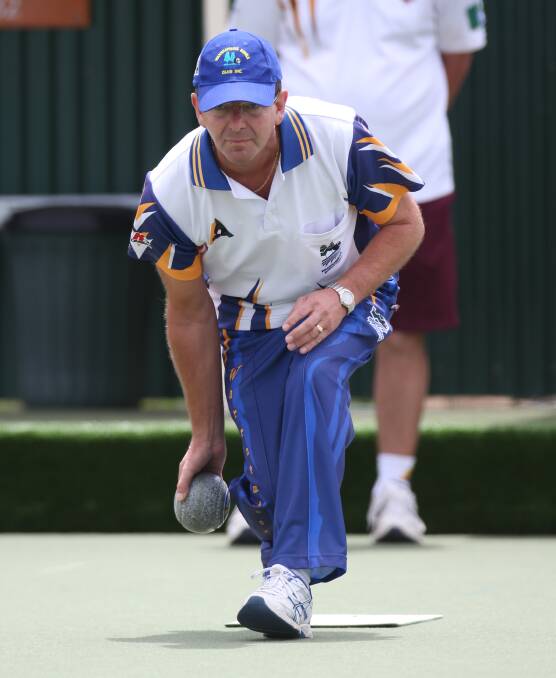 FOCUSED: Warrnambool Gold skipper Peter Pangrazio is all concentration as he eyes down the green against Timboon Gold. 