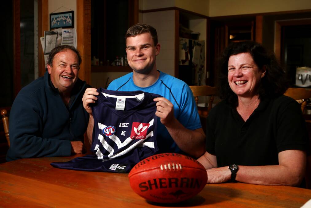 PURPLE HAZE: New Fremantle Dockers recruit
Sean Darcy with his proud parents Greg Darcy and
Ann-Maree Sullivan. Picture: Amy Paton