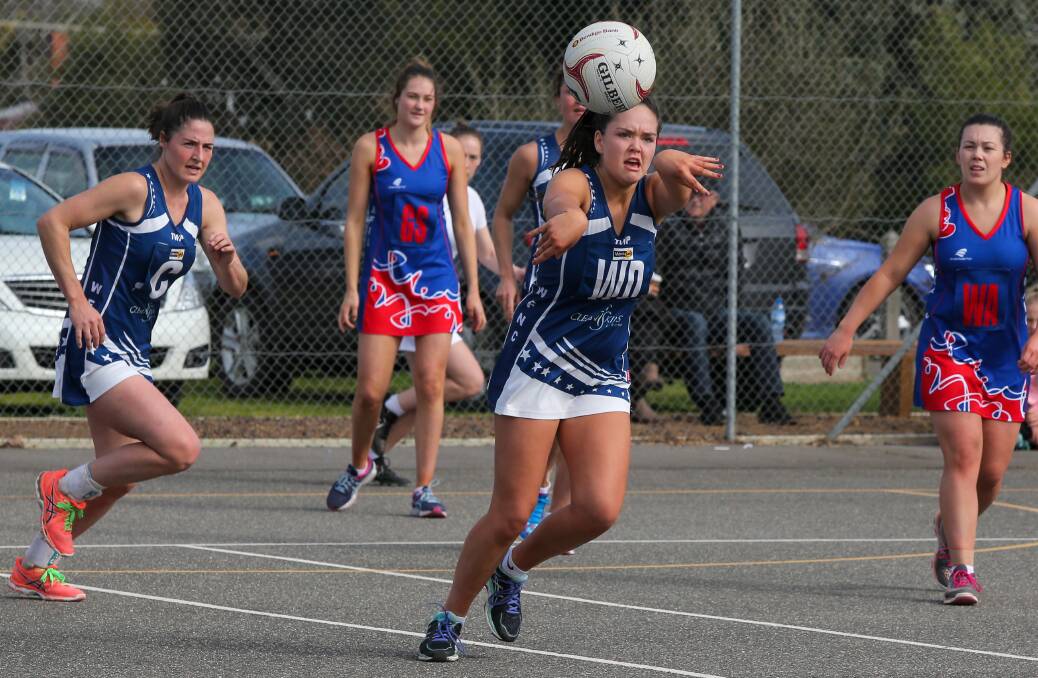 DOWN THE LINE: Warrnambool wing defence Sarah Smith sends the ball forward against Terang Mortlake on Saturday.