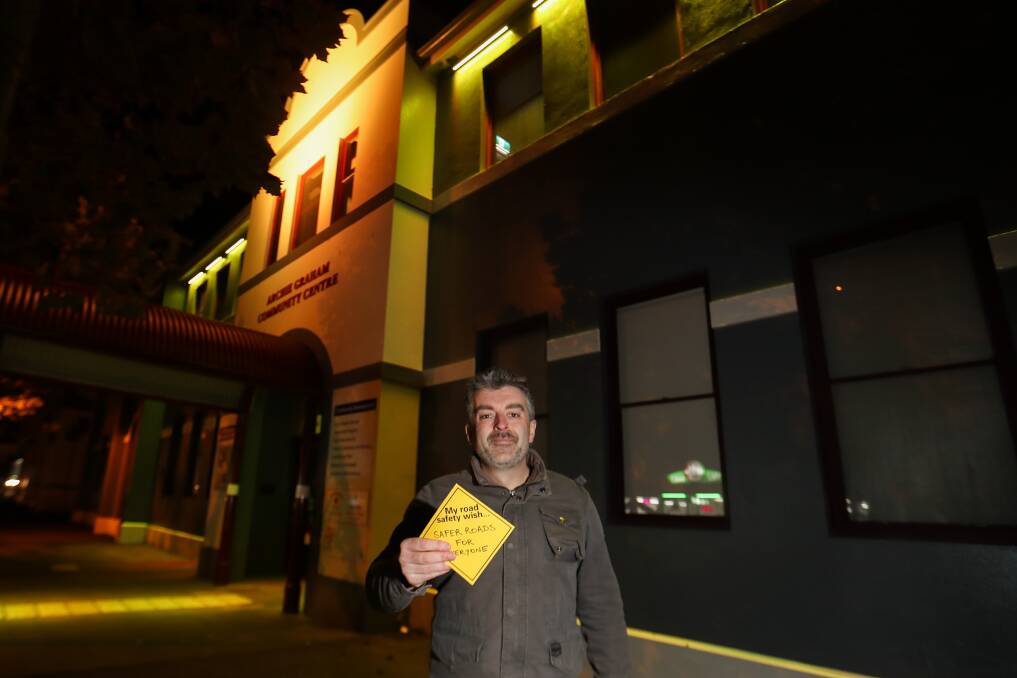 Warrnambool's Road Trauma Support Services Victoria regional coordinator Rhys Tate pictured in front of the Archie Graham centre that was lit up yellow for road safety awareness week. Picture: Morgan Hancock