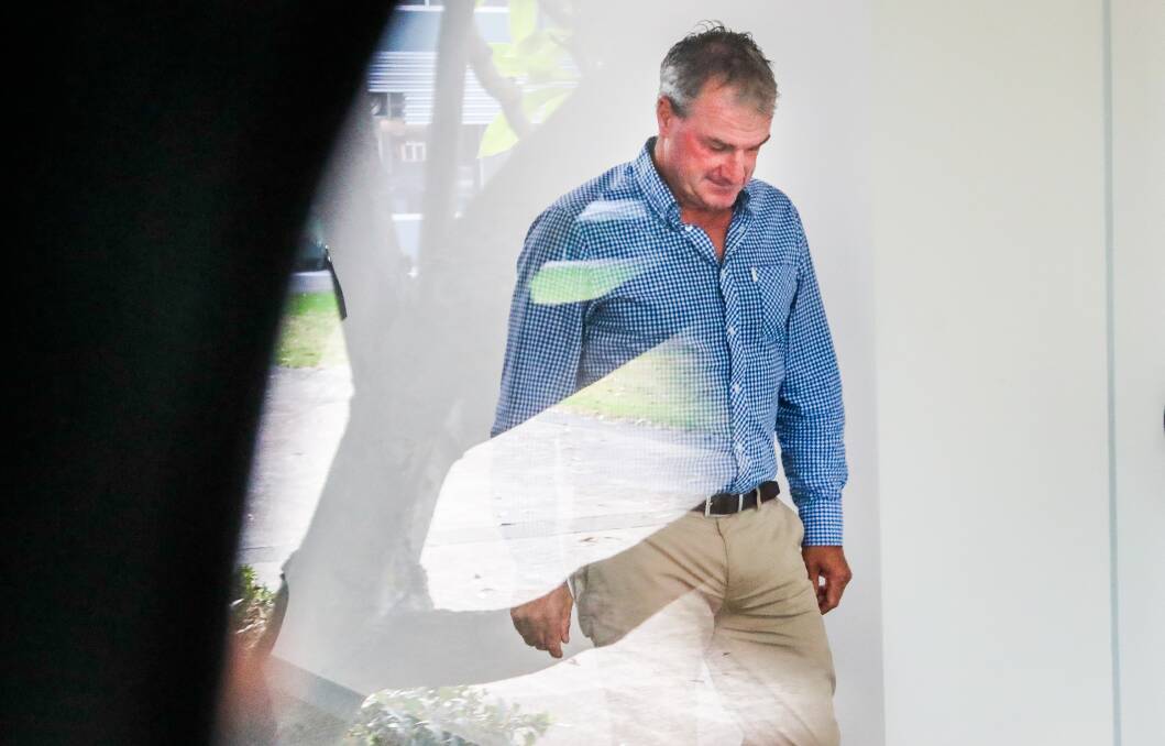 Shattered: Melbourne Cup-winning trainer Darren Weir leaves Racing Victoria headquarters on Wednesday morning after he was banned for four years. Picture: Jason South