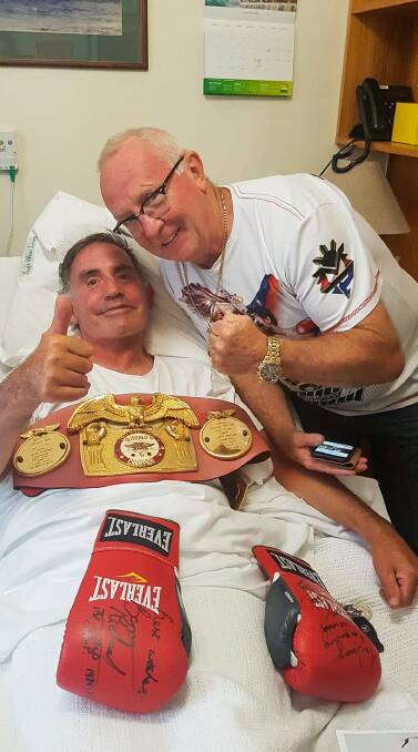 Hang in there, pal: Port Fairy boxing devotee Jim Pevitt with former International Boxing Federation Super Featherweight Champion Barry Michael on Tuesday. Picture: Jo Coomber