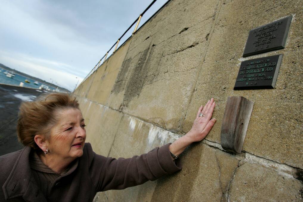 IN TOUCH: Barb Heazlewood at the memorial plaque for her husband Gerald "Prop" Heazelwood and her son David Heazlewood. They died at sea after a boat accident in January, 2000. 