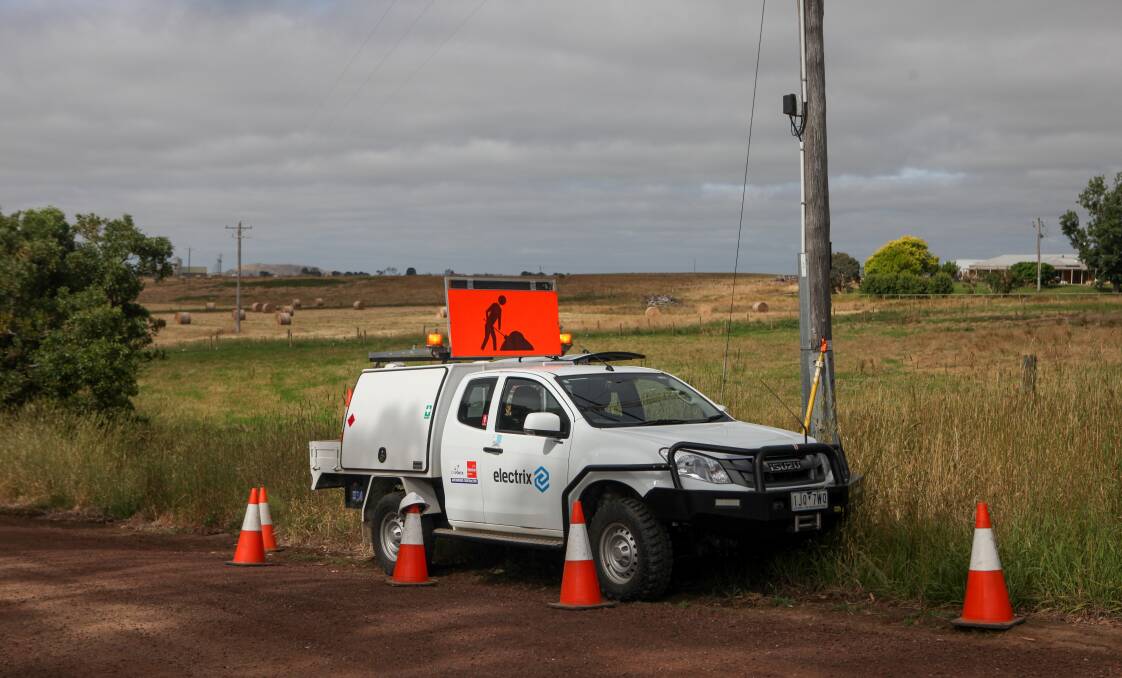 ON the job: A team from Powercor's maintenance contractor Electrix perform checks on a power pole ... Powercor says it is dropping south-west prices and increasing maintenance. Picture: Rob Gunstone