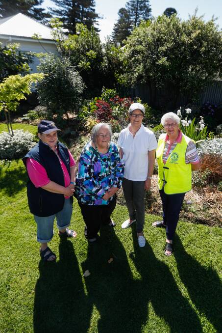 BLOOMING: Rotary's Sue Robertson, Margaret Whitehead (second left) and Hester Woodrup (right) and home owner Jennifer Whitehead. Picture: Morgan Hancock
