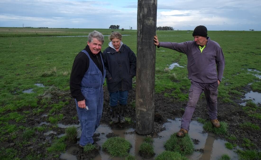 POWER FAIL: Jack and Betty Kenna and Bernie Harris with the new power pole installed on the Kennas' property: "Powercor should get on national television and apologise." Picture: Rob Gunstone