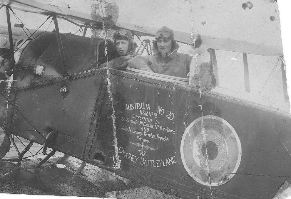 HEROES: Pilot Paul McGinness (left) and his great mate and gunner Hudson Fysh (right) in their Bristol fighter in Palestine. The pair became aces, served with Lawrence of Arabia and co-founded Qantas on their return from WWI.