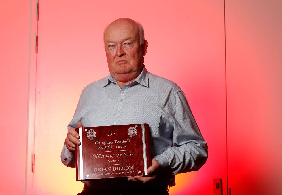 HUMBLED: Brian Dillon pictured with his 2019 Hampden Football Netball League award. Photo: Mark Witte