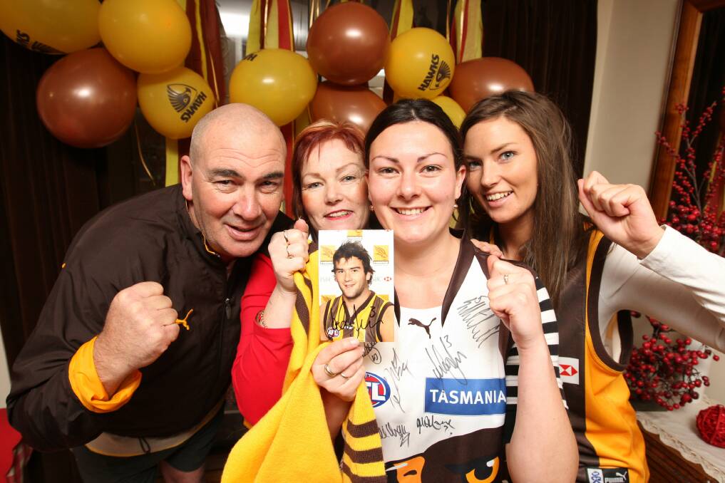 HOME CROWD: Shane with wife Judy and daughters Monique, 24, and Chelsea,19, before Hawthorn's 2008 grand final. 
