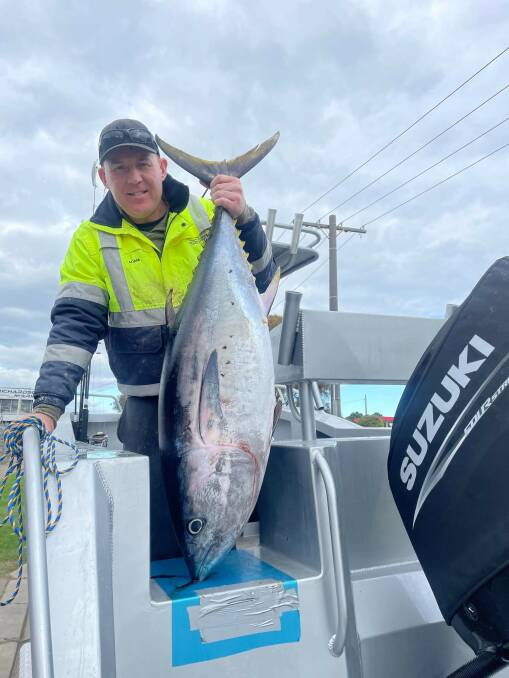 PLACE TO BE: Adam Vogels pictured with one of 10 school bluefin tuna that he and Steve Board caught off Port Fairy 