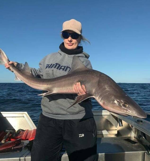 HOOKED: Amanda Richards with a quality gummy shark. Sharks and tuna have filled offshore reports this week, with some quality specimens. 