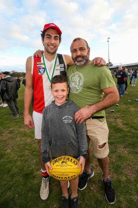 PREMIERS: Josh Chatfield celebrating the 2018 grand final victory with dad Joey and brother Harry. 