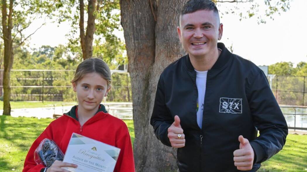 Craig Hollywood, WA's 2022 Local Hero, congratulates an Aussie of the Month recipient. Picture supplied.