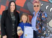 WA's 2020 Local Hero Suzy Urbaniak, right, and Regional Director WA Department of Home Affairs Samantha Patuto, left, congratulate an Aussie of the Month recipient. Picture supplied 