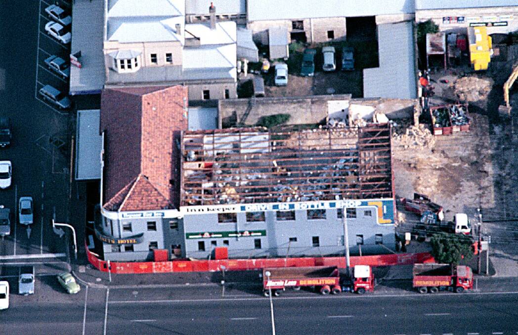 Tatts Hotel, during its demolition in 1997, on the corner of Liebig Street and Raglan Parade