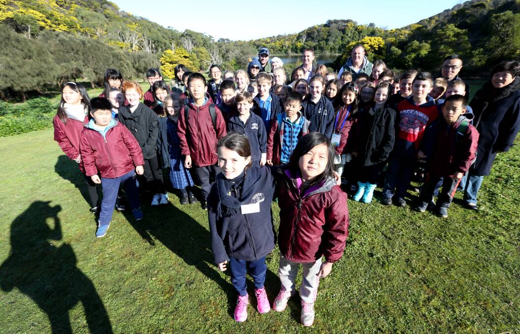 INTERNATIONAL LINKS: Amelia Rouse from Woodford Primary School and Lisa Lan from Jinling Primary School along with students and teachers from Woodford, Laurimar and Jinling primary schools. Picture: Vicky Hughson