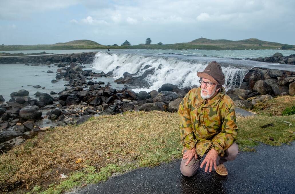 WILD: Port Fairy historian Marten Syme at the Griffiths Island causeway during a storm in April. Picture: Chris Doheny