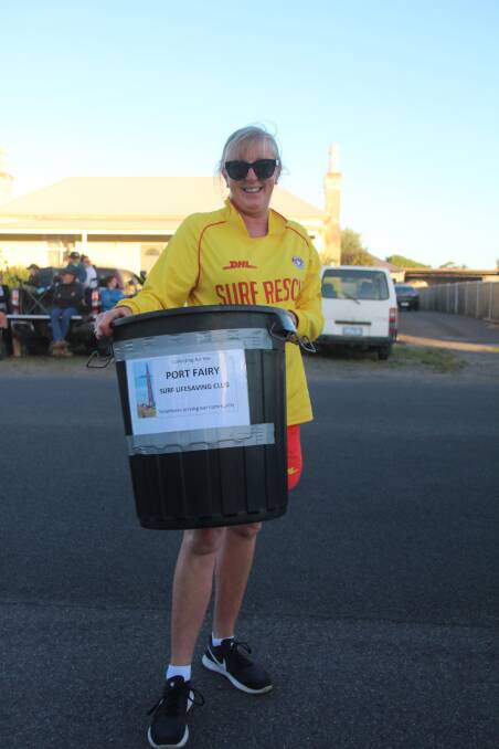 HARD-WORKER: Martina Murrihy on duty collecting for the Port Fairy Surf Life Saving Club during the New Year's Eve procession. 