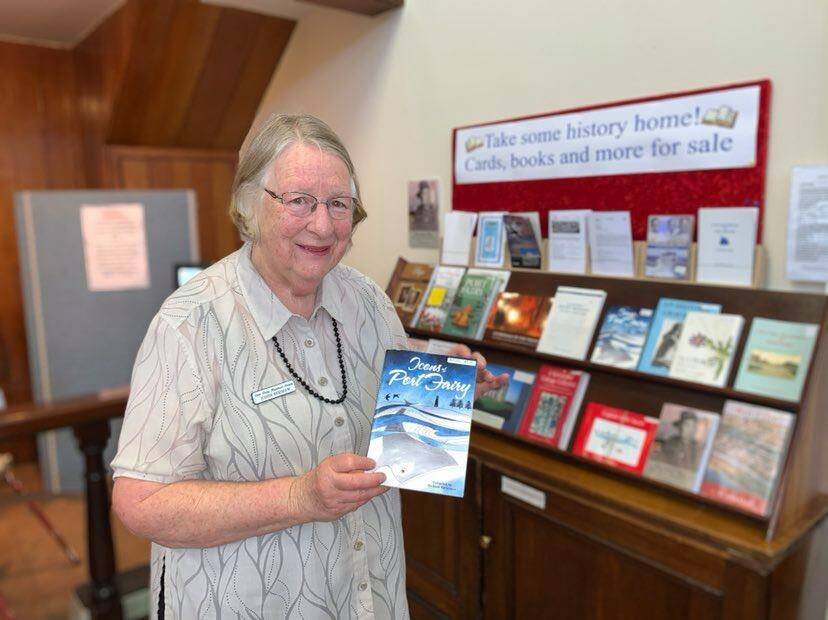 STORY TIME: Port Fairy Historical Society member Judith Kershaw with some of the books on sale at the museum. Picture: Anthony Brady 