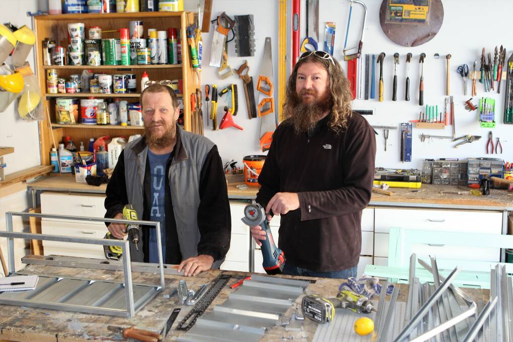 BUILDING: Andrew Synnes and Scott Muller are enjoying their time as part of the Warrnambool Men's Shed at SEAL Inc. Picture: Anthony Brady