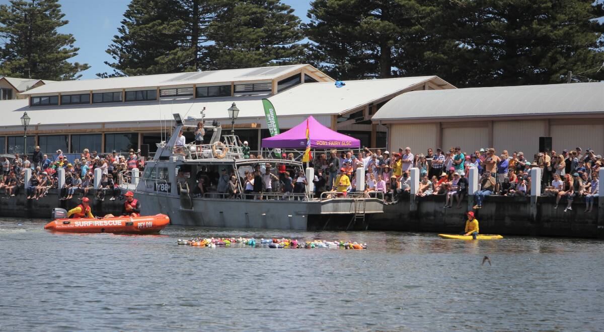 RACING: A big crowd watched on as the Duck Derby was held on the Moyne River in Port Fairy on New Year's Day. Picture: Anthony Brady 