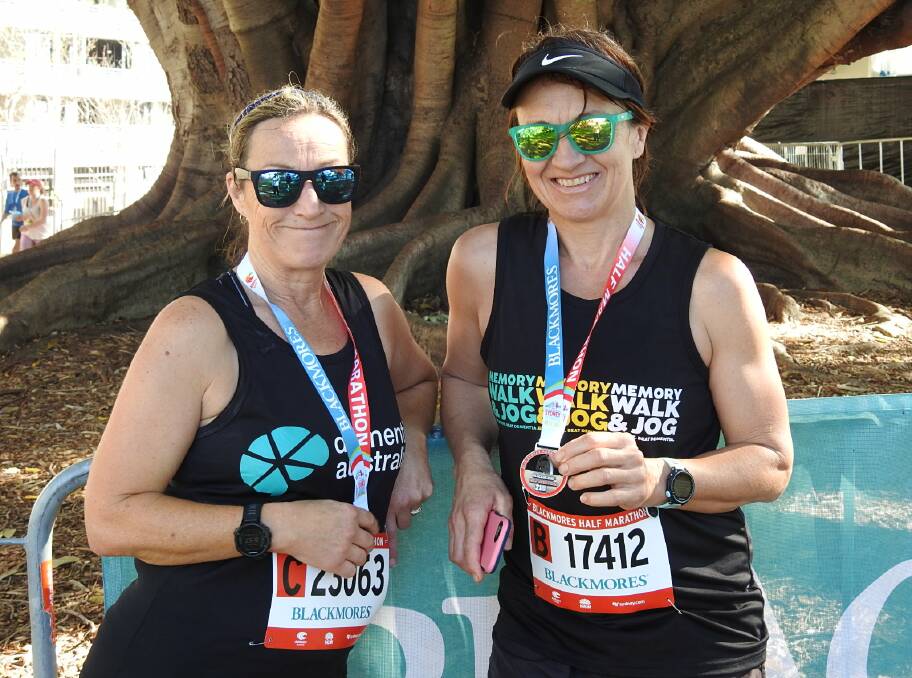 JOB DONE: Julie Emonson and Jenny Stone relax after successfully completing the Sydney Habour Bridge run last weekend.