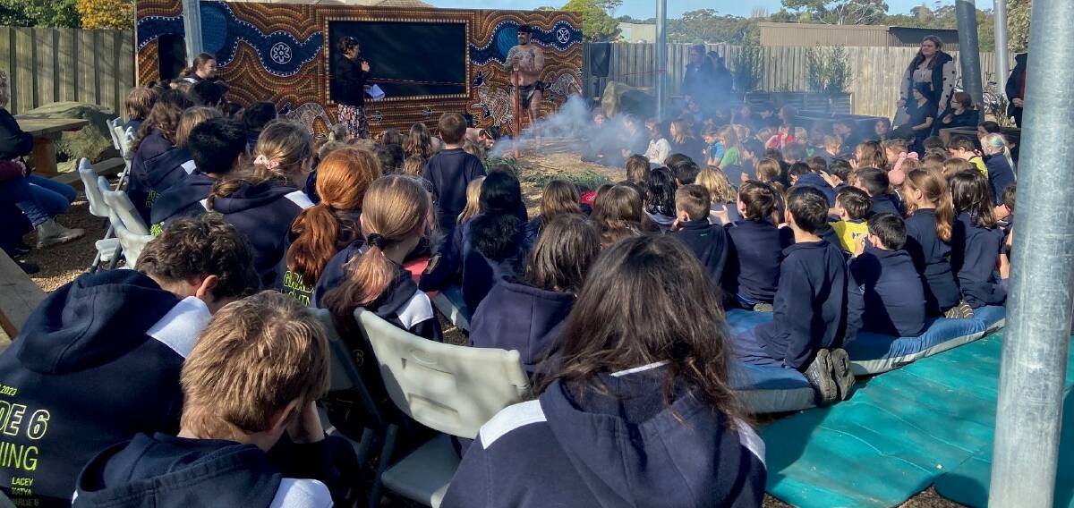 Staff, students and parents during the smoking ceremony at the opening of the new outdoor learning classroom at Koroit and District Primary School. Picture supplied