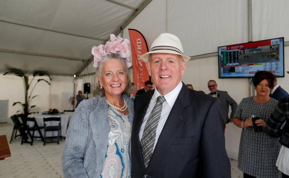 DRESSED UP: Real estate agents Penny and Nick Adamson at the races on Thursday. 