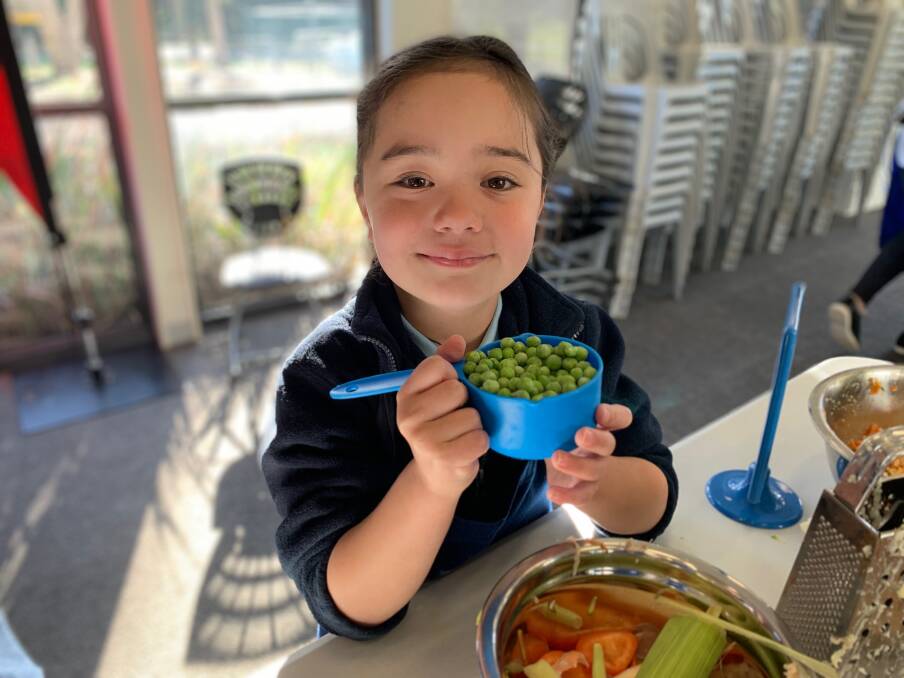 EAT UP: Woolsthorpe Primary School prep class member Aria Toki was busy in the kitchen as students put their cooking skills to the test. 