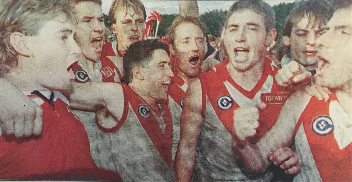 SING IT LOUD: South Warrnambool players celebrate their 1996 grand final win over Terang at DC Farren Oval in Mortlake. 