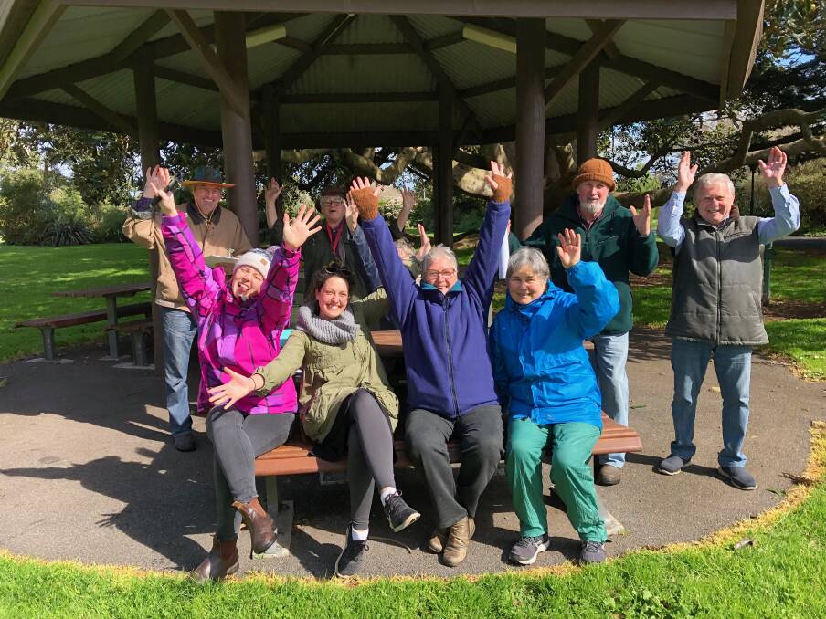 HAPPY: Committee members of the Replenish Our Planet Living Festival gather in the Koroit Botanical Gardens, the venue for the festival. 