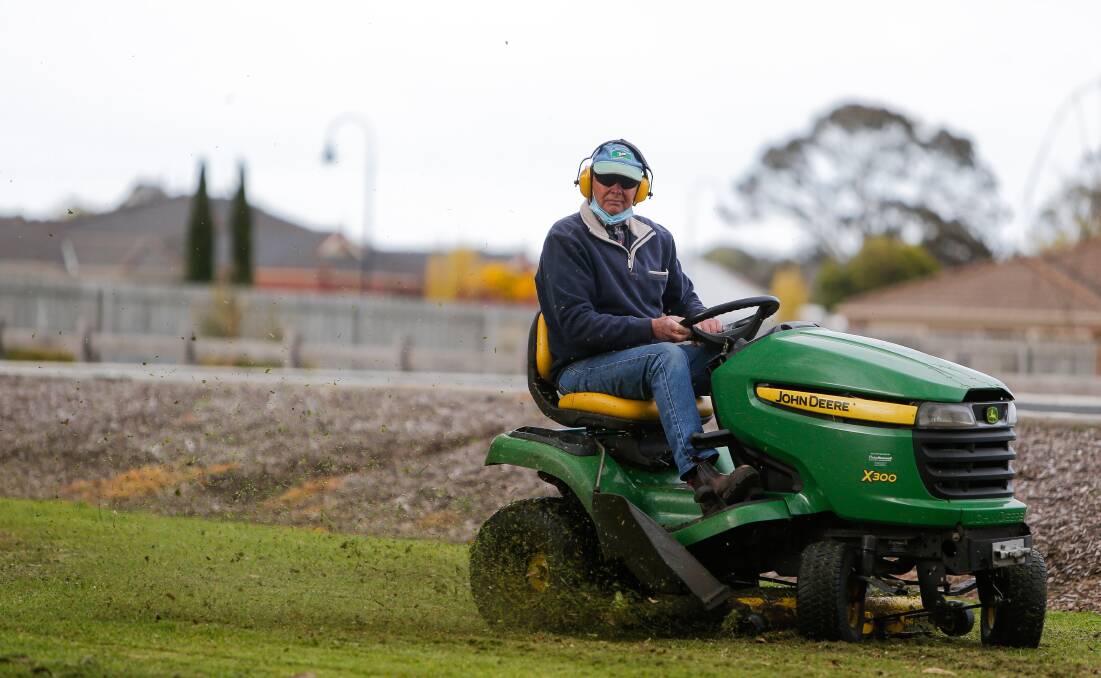 BUSY: Port Fairy to Warrnambool Rail Trail volunteer Frank Davey cutting grass. Funding is being sort for a new, bigger mower to maintain the trail. Picture: Anthony Brady