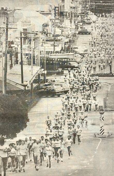 Runners in the 1983 Warrnambool Surf T Surf Fun Run charge down Liebig Street. File picture 