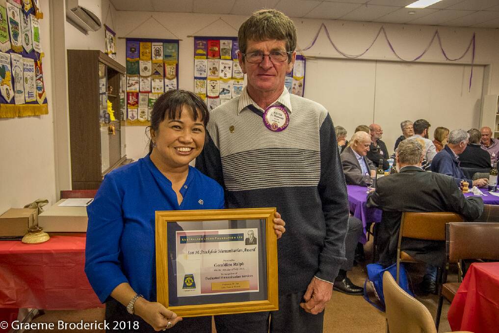 HONOUR: Geraldine Edar with her humanitarian award and Koroit Lions Club member Kevin Moroney. 