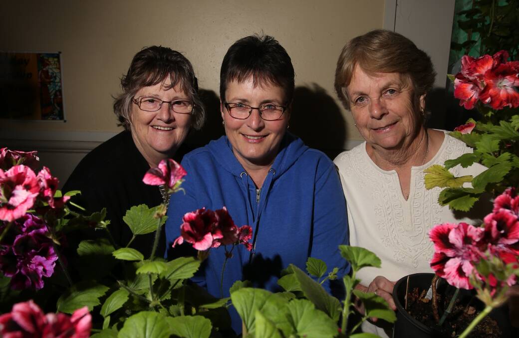 Marion Wright, Sandra Sell and Maureen Herd at their plant stall during the event in Port Fairy on Sunday. 