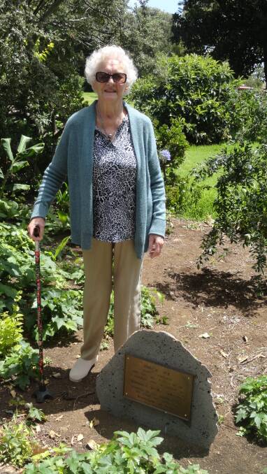 PROUD: Margaret Laurence with the plaque in her honour in the Koroit Botanic Gardens. 