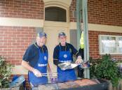 Koroit Lions Club members Peter McCarthy and Graeme Poynton cooking a barbecue at the Koroit Railway Station. The station will soon have a permanent barbecue facility. Picture: Anthony Brady