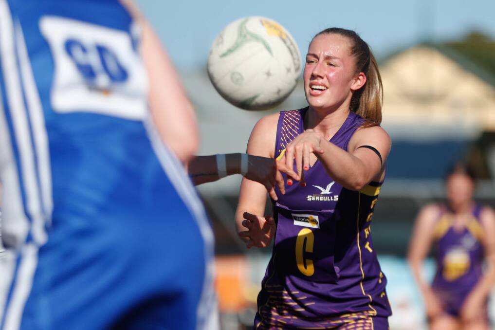 BUSY: Port Fairy's Tessa Allen shoots off a pass against Hamilton Kangaroos last Saturday. Picture: Chris Doheny. 