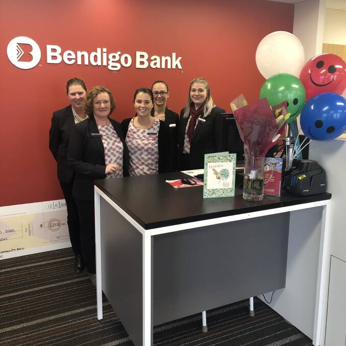 GOODBYE: Annie Giblin (middle) with her former workmates at Port Fairy and District Community Bank on her last day working at the bank.