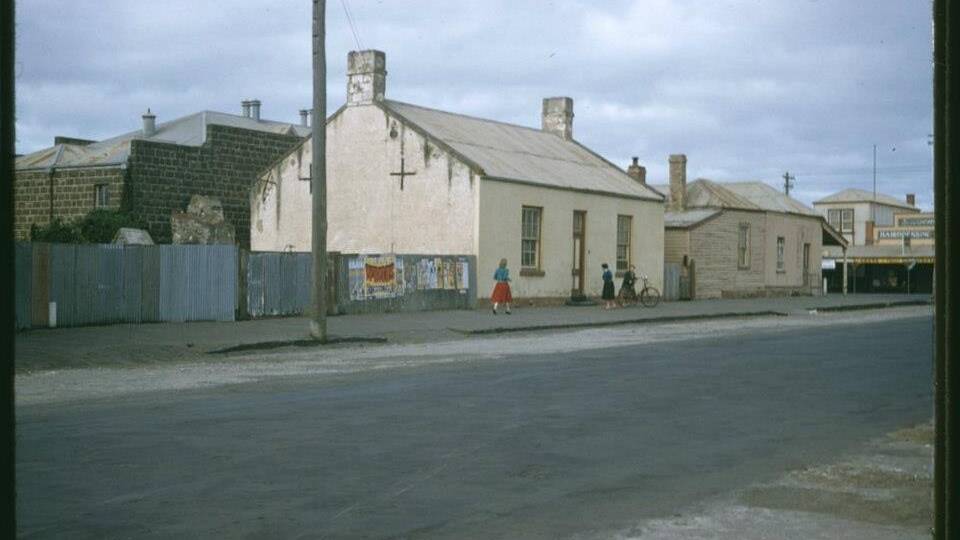 DIFFERENT: A 1950s photograph along Bank Street of what is now the site of Fiddler's Green. The site included a house and busineeses. Picture: Port Fairy and District Historical Society