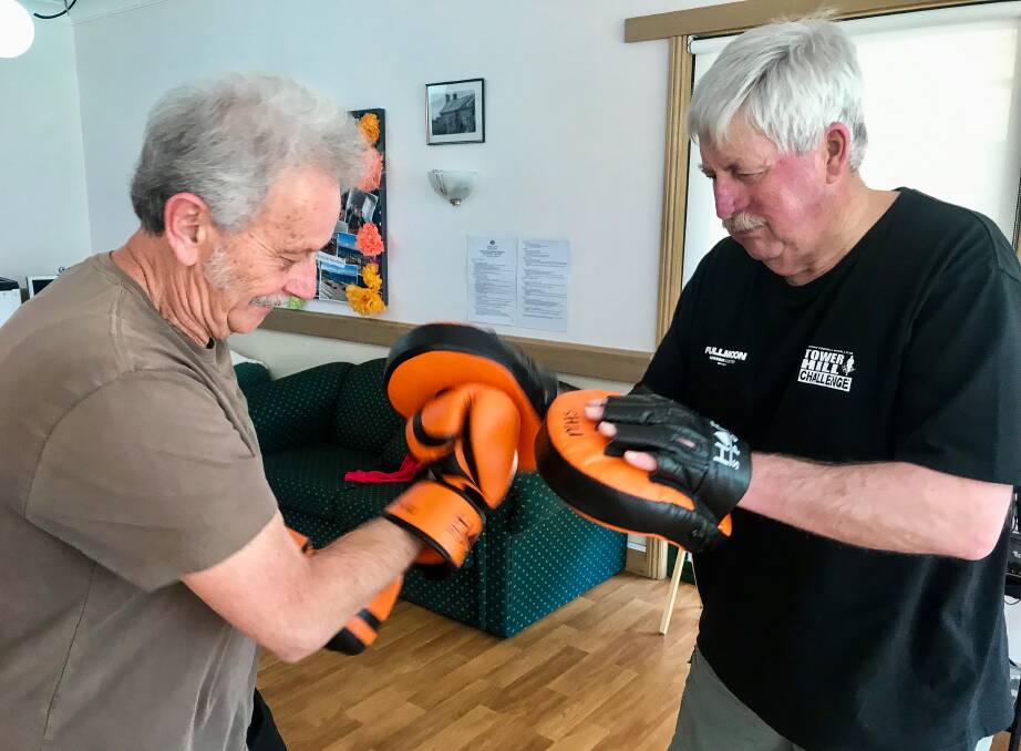 BOXING ON: Bob Bossy and Bob Hyland get in some sparring as part of the exercise classes. 
