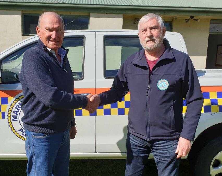 CHANGEOVER: New Port Fairy Marine Rescue Service president Max Holmes thanks former leader Russell Lemke for his efforts in the top job.