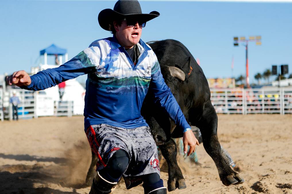 This cowboy was able to escape (just) from a rampaging bull at the Warrnambool Rodeo. Picture by Anthony Brady