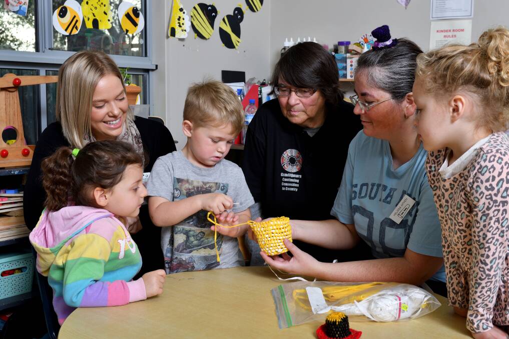 CAPTIVE AUDIENCE: Ava Sims, Blake Lumsden and Remi O'Connor learn about the art of weaving from Sandra and Melissa Aitken. South West Healthcare health promotion officer Jacinta Lenehan watches on. Picture: Robin Sharrock 