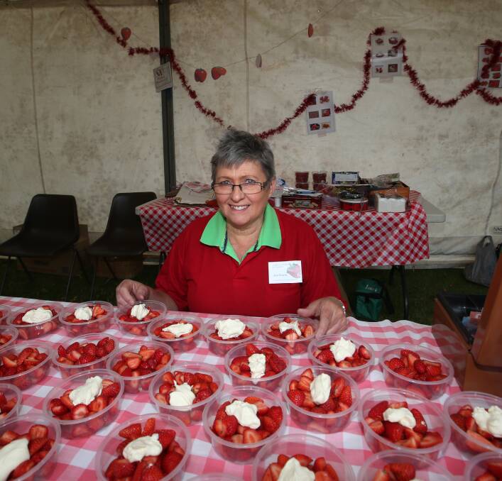 Jan Pearse, of Port Fairy, with some of the strawberries and cream on offer for patrons at the annual fete.